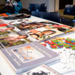 A table of WLT merchandise. Photo by Laura Hernandez.