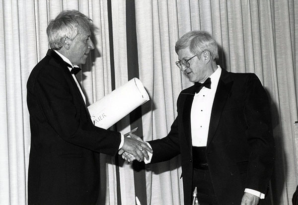Tomas Tranströmer (left) receiving the Neustadt Prize certificate from University of Oklahoma president Richard Van Horn in June 1990.